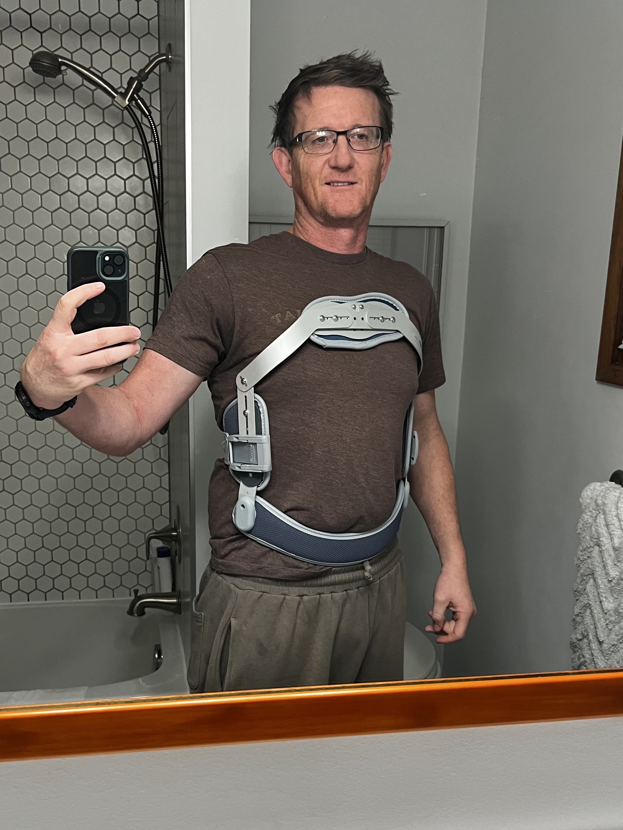 Jason wearing a back brace during recovery